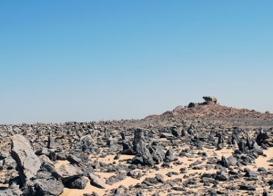 Field of upright stones with the sanctuary at Gebel Tingar in the background