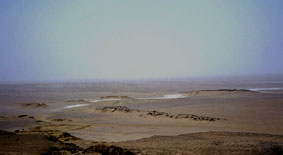 The harbour area with the Old Kingdom basalt quay (middle) at Qasr el-Sagha