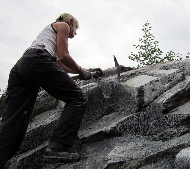 Eva Stavsøien extracting soapstone the traditional way with a pick axe
