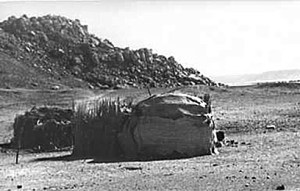 Campsite of Ababda Bedouins in Wadi Abu Subeira in the early 1980s. The rock art site CAS-6 is in the background. Photo: Stephan Seidlmayer, with thanks. Campsite of Ababda Bedouins in Wadi Abu Subeira in the early 1980s. The rock art site CAS-6 is in the background. Photo: Stephan Seidlmayer, with thanks.