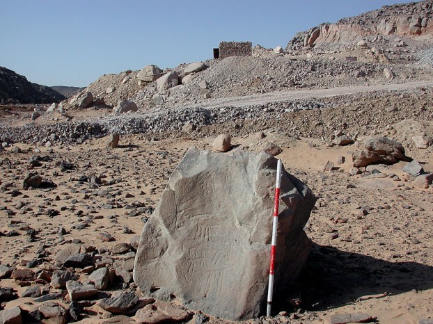 Subeira: A lonely stone with Predynastic rock art and a modern clay mine in the background. Photo: Adel Kelany Subeira: A lonely stone with Predynastic rock art and a modern clay mine in the background. Photo: Adel Kelany