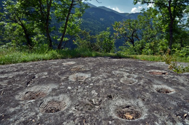Apart from famous Carschenna there are few real rock art sites in Grisons. But there is a wealth of prehistoric sites with cup marks (German: Schalensteine), such as this site called Grep Patnasa by Dardin near Brigels in Surselva. More info at Wikipedia and steinkreis.ch. Photo: Per Storemyr