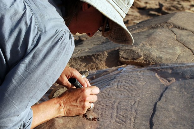Isabelle Therasse of the Royal Museums of Art and History in Brussels drawing the Epiplalaeolithic masterpiece rock art. Photo: Per Storemyr