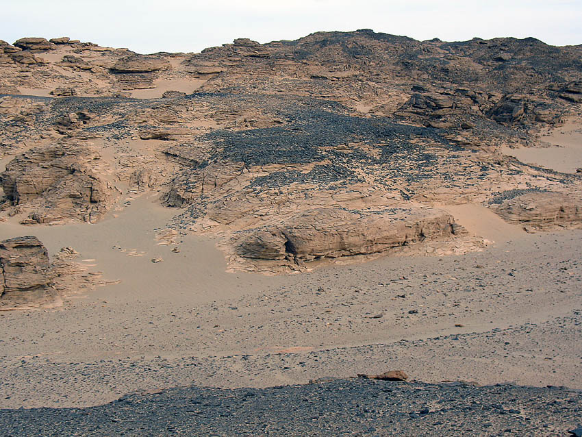 This is a great Palaeolithic quarry by Wadi Beiza in the Eastern Desert. It was the black, hard stone that was exploited. Photo: Per Storemyr