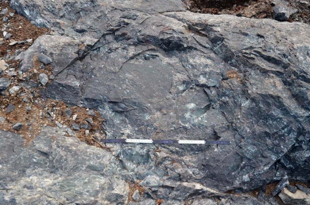 The typical circular form with convex bottom of an ancient fire set spot in the Melsvik quarries. Photo: Per Storemyr
