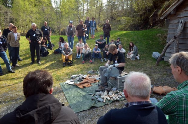 The annual Hyllestad seminar draws researchers and laypersons to the centre. Here from the April 2014 seminar, with archaeologist Morten Kuchera demonstrating flint knapping. Photo by Per Storemyr
