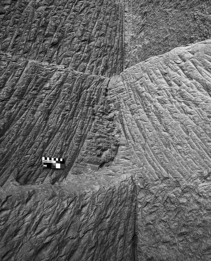 Pick (center) and chisel (top and bottom) tracks in the Ptolemaic part of the Shesmetet sandstone quarry near el-Kab. Smallest scale division is 1 cm. Photo by PER STOREMYR.