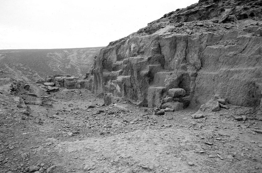 The 18th Dynasty Queen Tiy limestone quarry near Tell el-Amarna. Note the parallel chisel tracks from a small descending platform at right and the non-systematic quarrying traces to the left which resemble those in Middle Kingdom quarries. Photo by JAMES HARRELL.