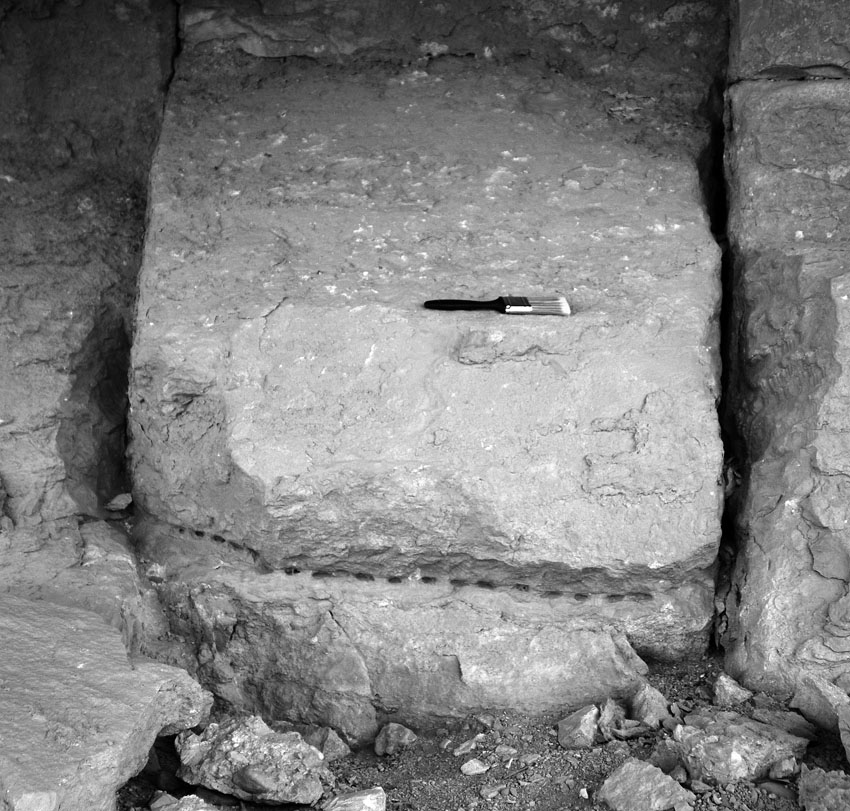 Partially extracted block in the 18th Dynasty part of the Qurna limestone quarry at Thebes. Note the line of chisel holes along the block’s base and the narrow trenches along its sides that must have been cut with a long chisel. A natural fracture separates the block’s back side from the bedrock. Brush is 21 cm long. Photo by JAMES HARRELL.