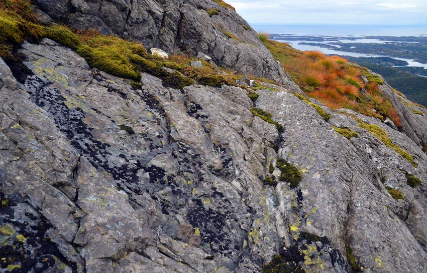 A quarry with a view to the Atlantic Ocean. Traces of firesetting at the Siggjo Neolithic rhyolite quarries. Photo by Per Storemyr