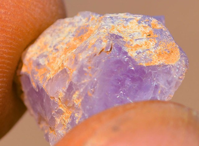 A fading raw amethyst from Wadi el-Hudi, Egypt. The purple variety of quartz. Photo by Per Storemyr