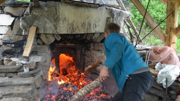 Per working in a sea of glowing charcoal!