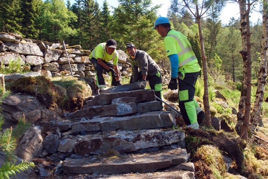 Impressed by the way Nepalese sherpa stone workers build a staircase in Hyllestad, Western Norway. Only manual work. Just looking. Photo by Per Storemyr