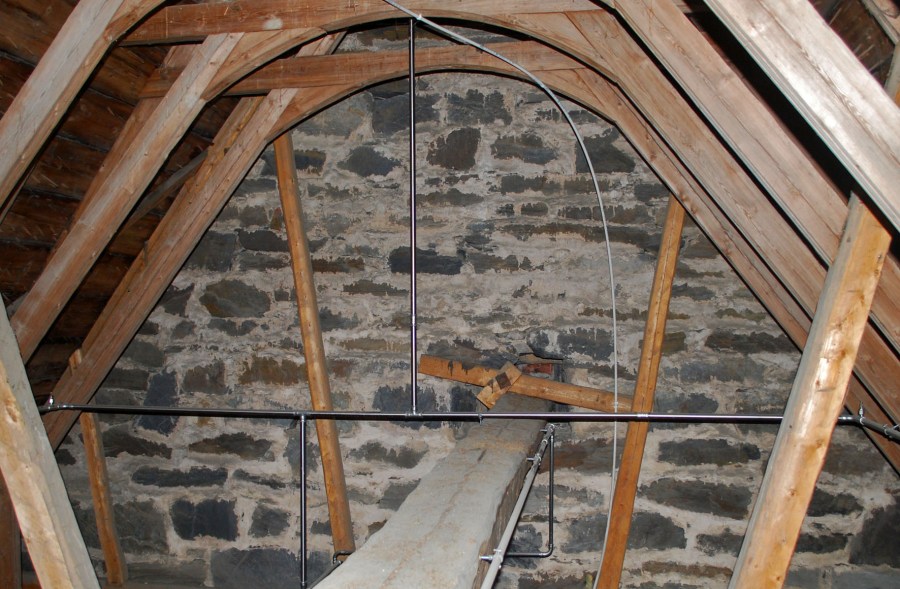 The eastern chancel wall at the loft of Ulnes church, with medieval joint mortars.
