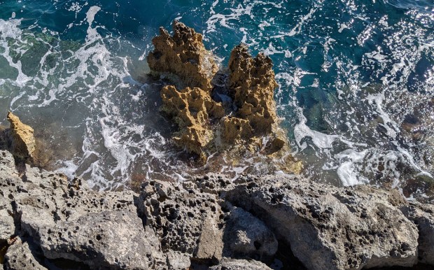 Biokarst on the south coast of Mljet, with holes from boring organisms and very sharp limestone edges. Photo by Per Storemyr