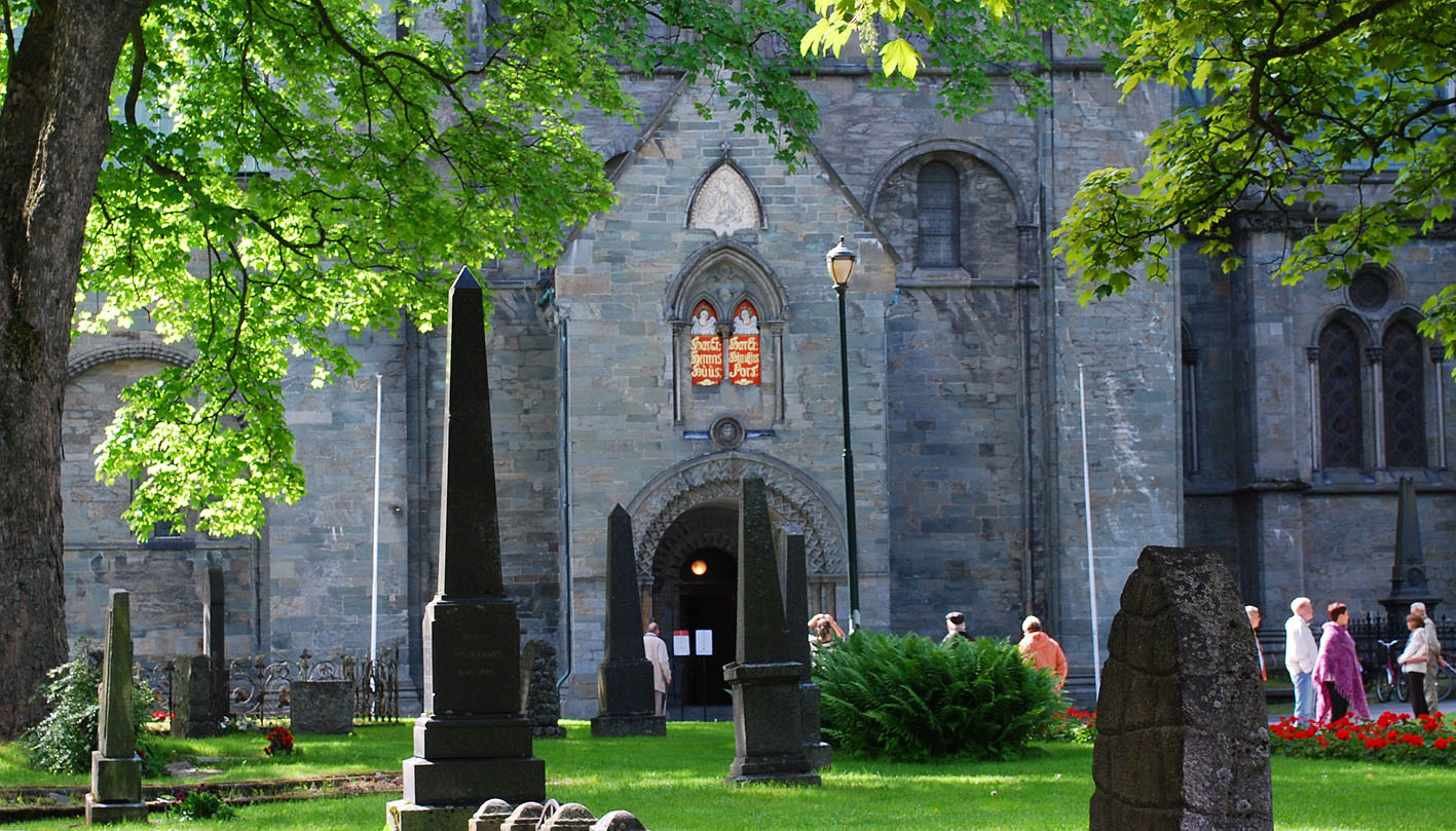 The Romanesque North Porch of Nidaros Cathedral, with St. Michael’s chapel above. The head sculptures are associated with the opening featuring a pointed, Gothic arch. Photo by PS