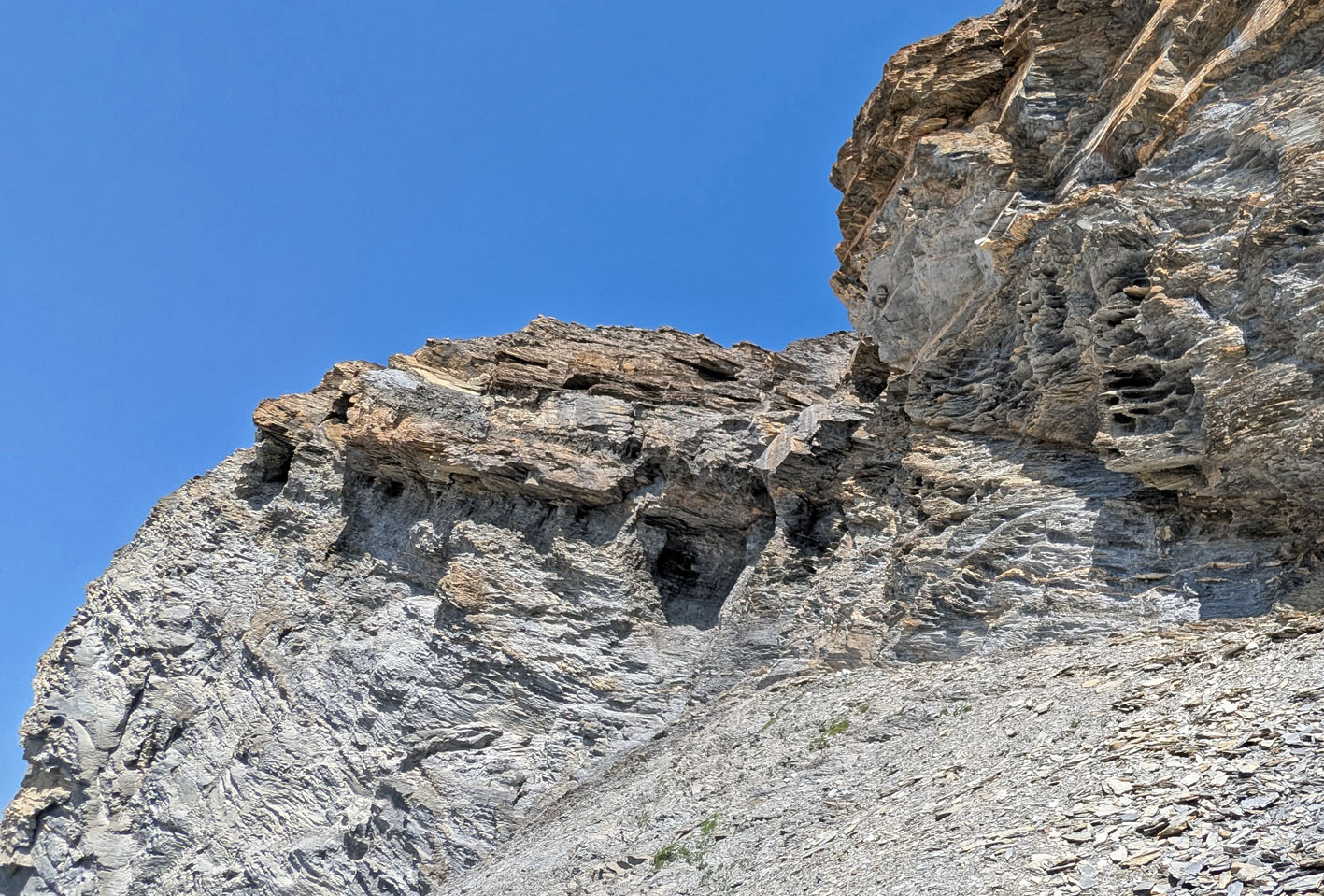 Tafoni (right) and caverns that may have developed partially due to tafoni. Muttenbergen W. Photo by PS