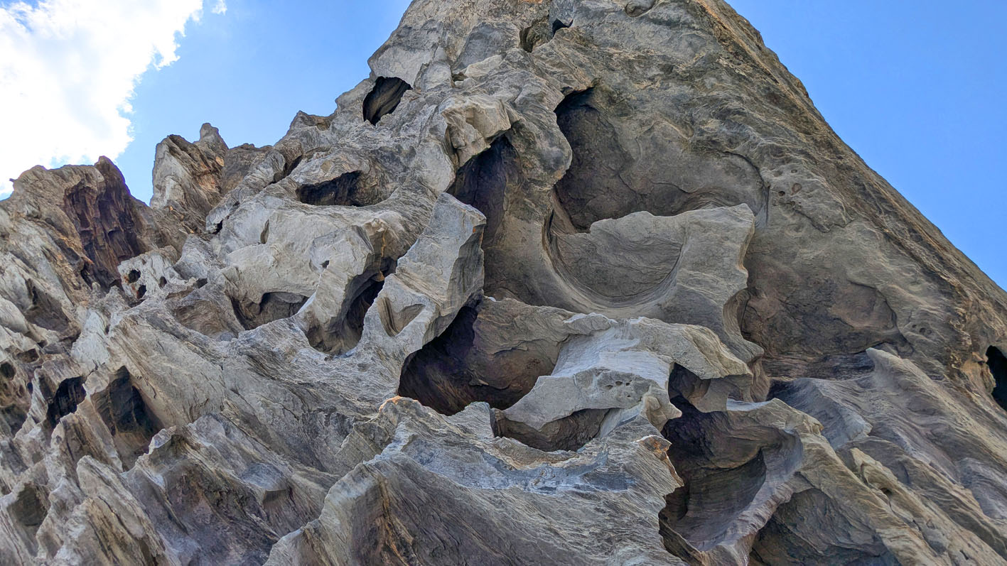 Larger-scale, connected tafoni making the rock look like a Swiss chese. (Kistenstöckli S). Photo by PS