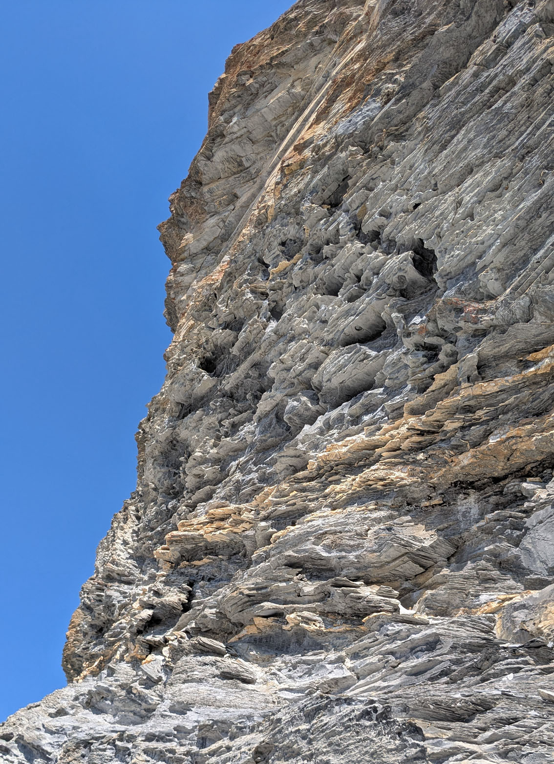 Tafoni and differential weathering in a c. 20-30 m high cliff (Muttenbergen W). Photo by PS